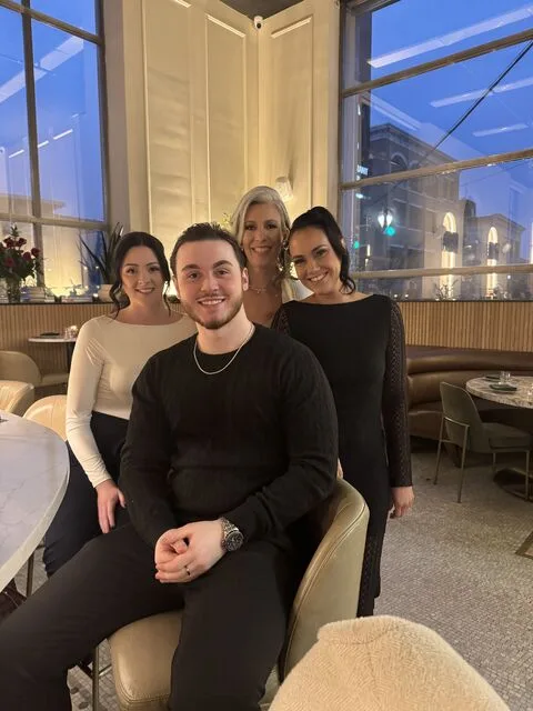 Jamie with a group at a dinner